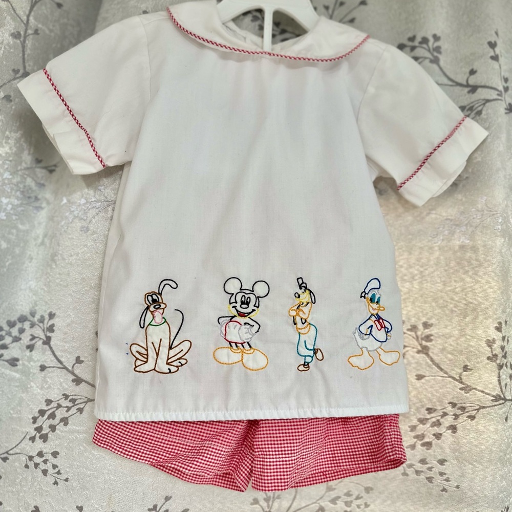White Shirt with Cartoon Characters and Red Shorts